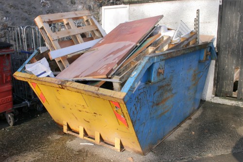 Business professionals managing waste with a skip