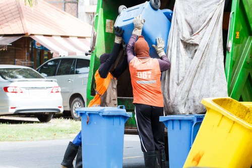 Workers sorting construction waste for recycling in Brixton